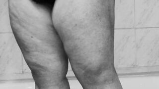 Fat MILF shaves her twat in the shower - black and white