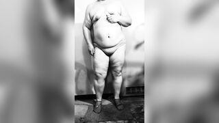 Fat MILF undresses exposed in the basement, showing off her big butt and curvy figure