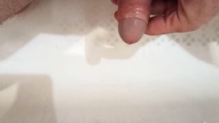 Pissing, spiting on the dickhead and jerk off in the bathroom.