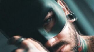 A mask beneath Bry Elijah's name -- 4K movie scene