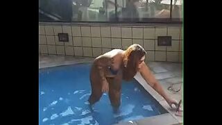 Married redhead showing off in the condo pool to a neighbor.