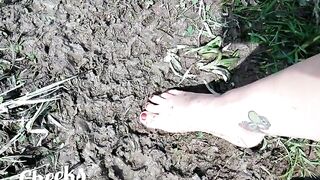 Bare feet in mud