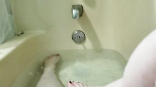 Washing my marvelous little feet in the bathtub.