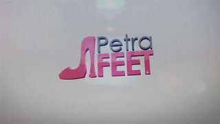 Leather Petra plays with her feet and smokes