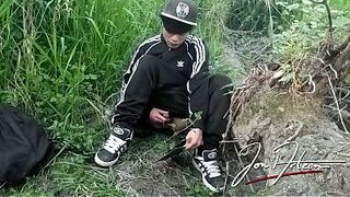 Cute Asian homo twink in a black-and-white adidas tracksuit and Campus sneakers masturbates and cums outdoors