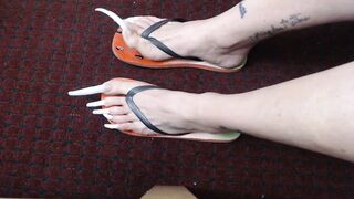 Very long toenails in flipflops