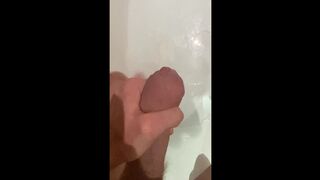 Concupiscent big jock dude wanking in the washroom, cumming in bathwater over feet, masturbating uncut big schlong