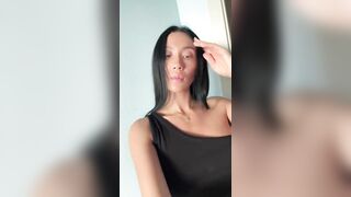 Curvy hotty teases with hand on her chest ?