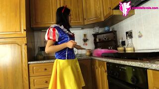 Hot brunette dressed as snow-white massages her feet