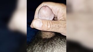 Stroking my bulky little curly cock whilst playing with her feet