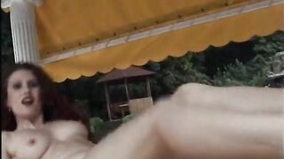 Gorgeous brunette masturbates outdoors