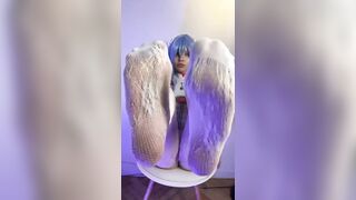 Thick thighs spread wide on the chair