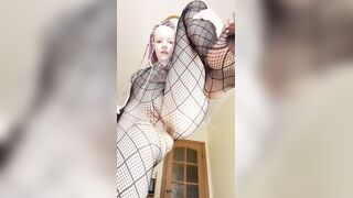 Thick legs spread wide in fishnet hosiery ?