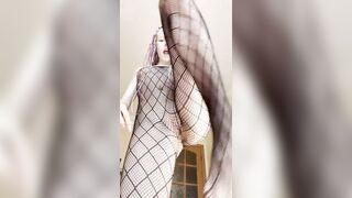 Thick legs spread wide in fishnet hosiery ?