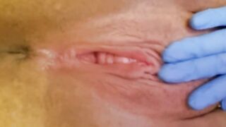 A gal nurse in gloves screws herself and shows her body