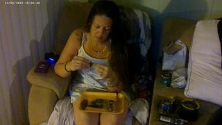 Busty angel in pink bra and panties smokin' and playing movie scene games