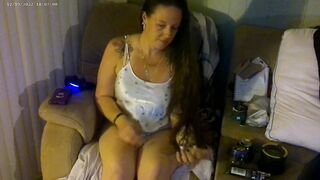 Busty angel in pink bra and panties smokin' and playing movie scene games