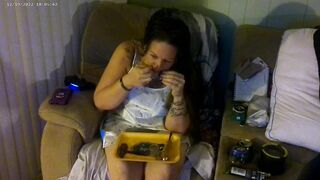 Busty angel in pink bra and panties smokin' and playing movie scene games