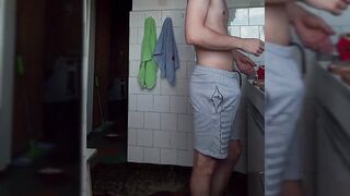 Corpulent ramrod in gray shorts. Handjob in the kitchen while preparing breakfast