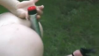 Tiny titted sweetheart is filling her both holes with a worthy sex-toy outdoors