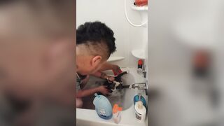 Nice-looking girl gives kitten a bathroom
