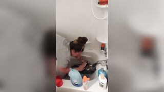 Nice-looking girl gives kitten a bathroom