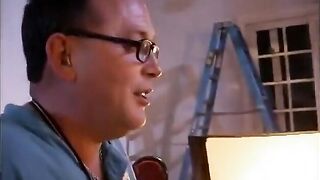 Behind the scenes footage of a camera crew filming a porn movie