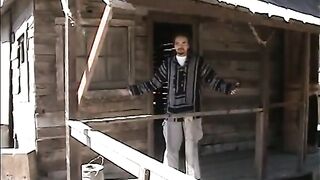She pulls her legs back to give him a footjob