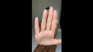 Hand blocks view but legs stay spread wide ?