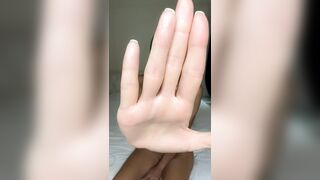 Hand blocks view but legs stay spread wide ?