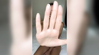 Hand blocks view but legs stay spread wide ?