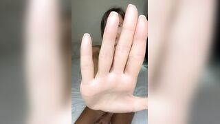 Hand blocks view but legs stay spread wide ?