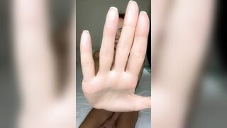Hand blocks view but legs stay spread wide ?