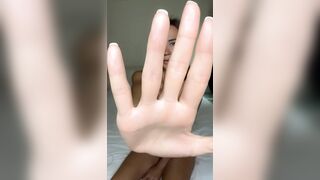 Hand blocks view but legs stay spread wide ?