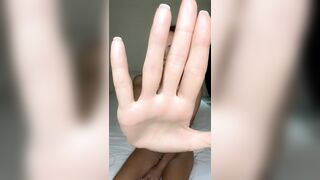 Hand blocks view but legs stay spread wide ?