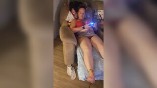 Filming up white gal girl's micro mini dress while this playgirl's playing fortnite and this honey's loving it