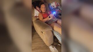 Filming up white gal girl's micro mini dress while this playgirl's playing fortnite and this honey's loving it