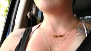 Girl films up her own black minidress and teases with her panties in public during the time that I'm driving