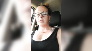 Girl films up her own black minidress and teases with her panties in public during the time that I'm driving