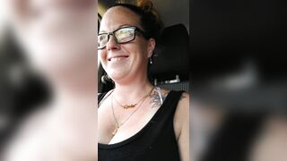 Girl films up her own black minidress and teases with her panties in public during the time that I'm driving