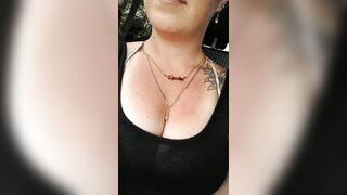 Girl films up her own black minidress and teases with her panties in public during the time that I'm driving