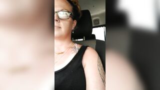 Girl films up her own black minidress and teases with her panties in public during the time that I'm driving