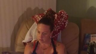 Pretty girl in black mini suit lifts up her dress and play fortnite while smokin' cigarettes
