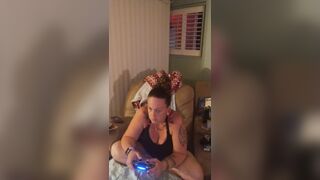 Pretty girl in black mini suit lifts up her dress and play fortnite while smokin' cigarettes