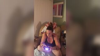 Pretty girl in black mini suit lifts up her dress and play fortnite while smokin' cigarettes
