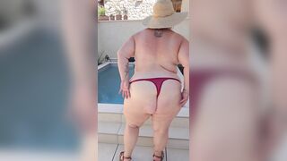 I show myself stripped outside next to the pool