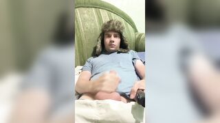 A dude lies down, jerks off, cums, eats cum, and plays with a lighter.