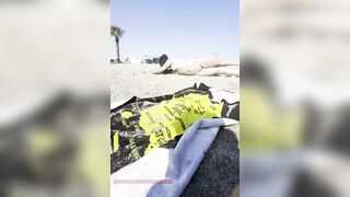 Bare girl playing in the sand?