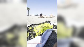 Bare girl playing in the sand?