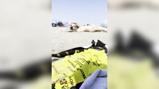 Bare girl playing in the sand?